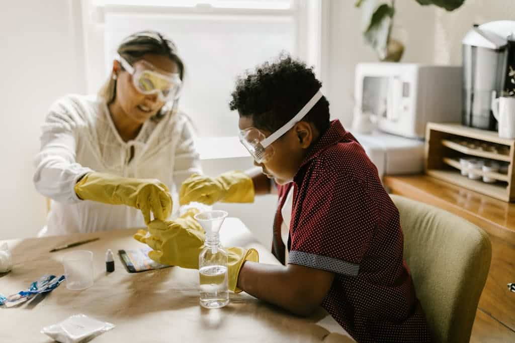 Mother and son conducting a fun science experiment together at home, fostering creativity and learning.